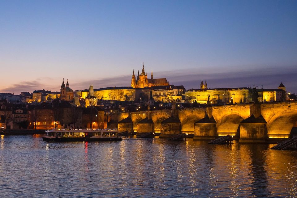 56567995-prague-night-boat.jpeg